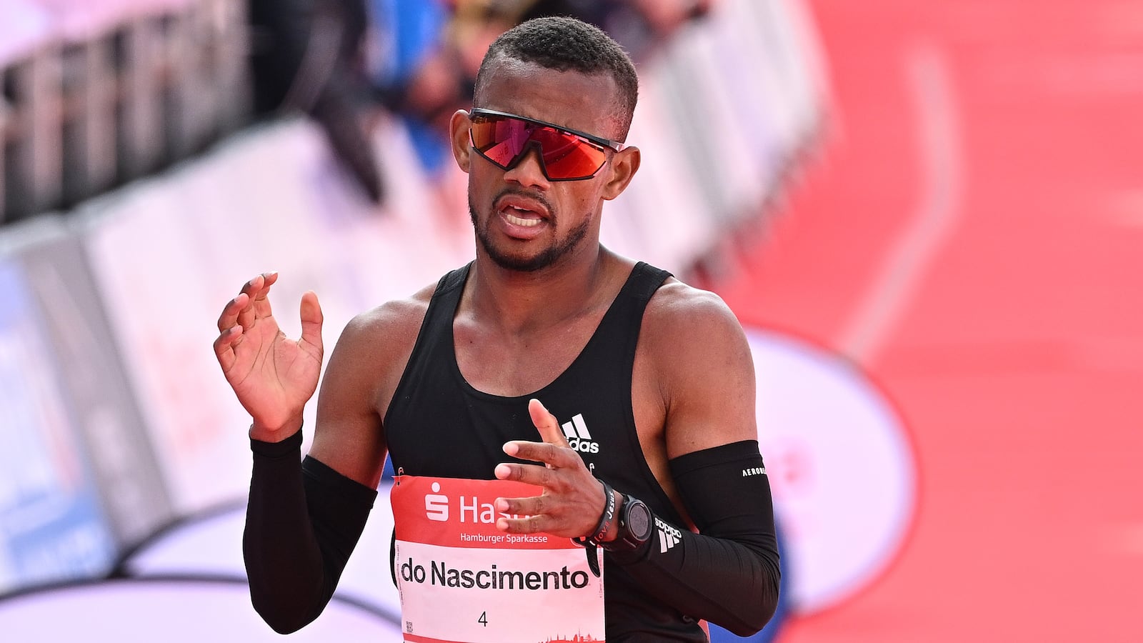 HAMBURG, GERMANY - APRIL 23: Daniel do Nascimento of Brazil crosses the finish line at the Haspa Marathon Hamburg 2023 on April 23, 2023 in Hamburg, Germany. (Photo by Stuart Franklin/Getty Images for adidas)