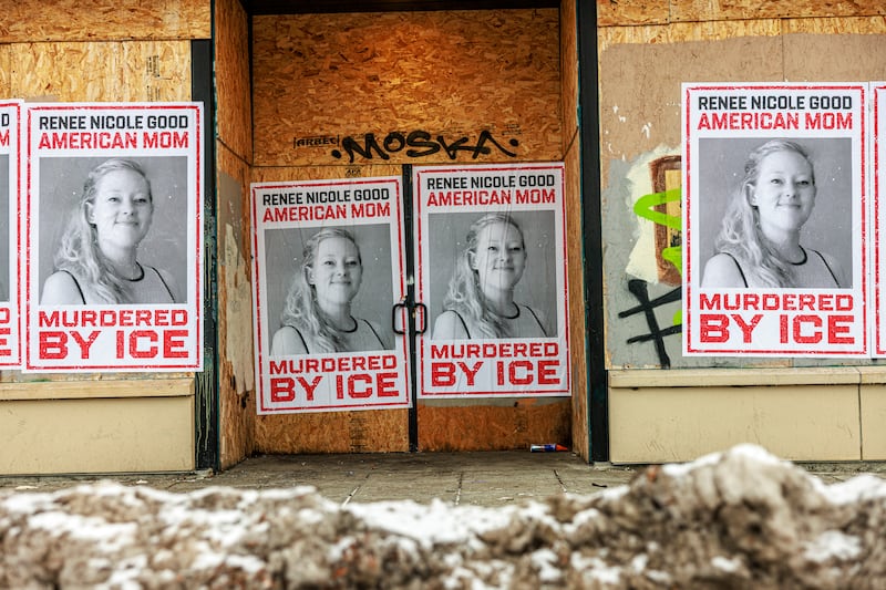 Businesses boarded up in parts of Minneapolis display posters of Renee Nicole Good on plywood-covered windows following her fatal shooting by an ICE agent, in Minneapolis, Minnesota, on January 11, 2026. A US Immigration and Customs Enforcement (ICE) agent shot and killed 37-year-old Renee Nicole Good on the streets of Minneapolis on January 7, leading to huge protests and outrage from local leaders who rejected White House claims she was a domestic terrorist. (Photo by Kerem YUCEL / AFP via Getty Images)