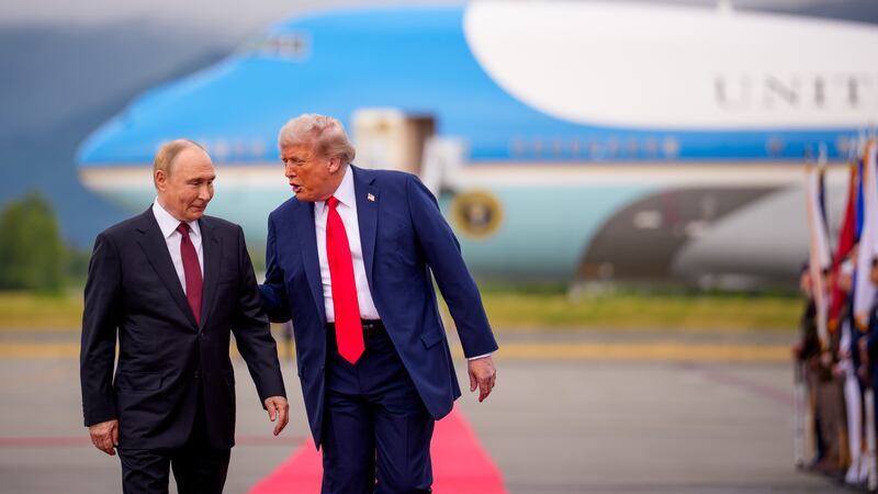 President Donald Trump greets Russian President Vladimir Putin as he arrives for a meeting on August 15, 2025 in Anchorage, Alaska. The two leaders held peace talks aimed at ending the war in Ukraine.