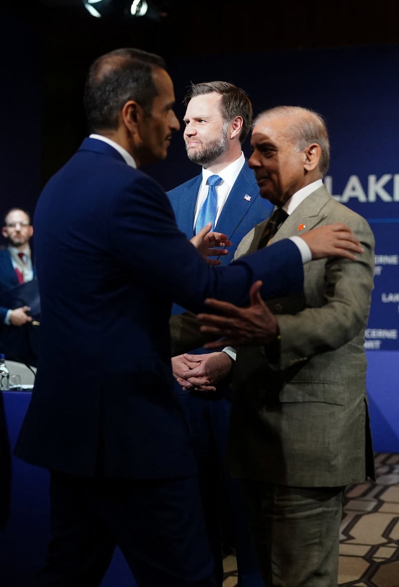 U.S. Vice President JD Vance looks on as Pakistan's Prime Minister Shehbaz Sharif and Qatar's Prime Minister and Minister for Foreign Affairs Sheikh Mohammed bin Abdulrahman bin Jassim Al-Thani greet each other before the start of a quadrilateral meeting between the U.S., Iran, Pakistan, and Qatar at the Lake Lucerne Summit, aimed at advancing a deal to end the Middle East conflict, at Buergenstock Resort Lake Lucerne, near Stansstad, Switzerland, June 21, 2026. REUTERS/Nathan Howard/Pool