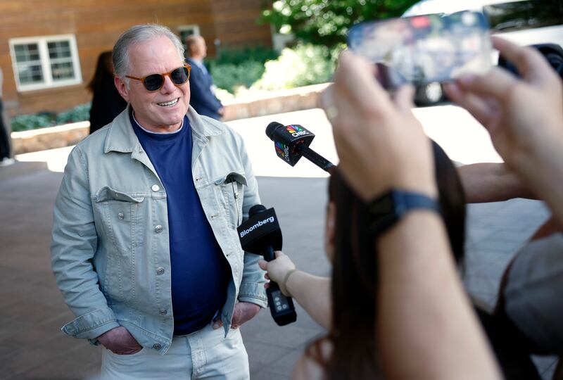 Warner Bros. Discovery CEO David Zaslav donned red sunglasses and a denim on denim look as he chatted with reporters at the conference.