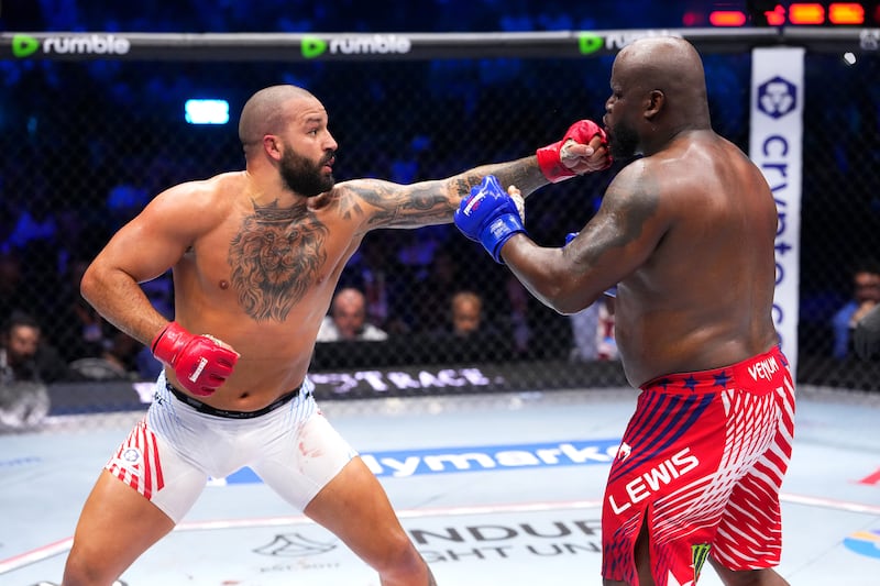 Josh Hokit strikes Derrick Lewis in a heavyweight fight during the UFC Freedom 250 event on the South Lawn at the White House on June 14, 2026 in Washington, DC.