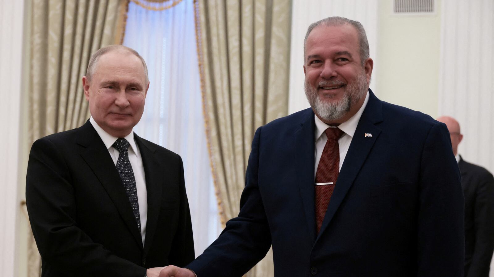Russian President Vladimir Putin shakes hands with Cuban Prime Minister Manuel Marrero Cruz during a meeting at the Kremlin in Moscow, Russia June 14, 2023.