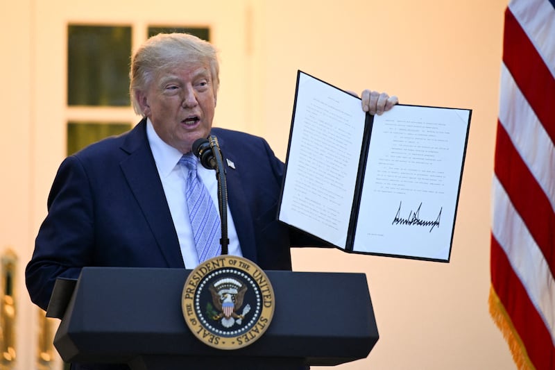 President Donald Trump holds an executive order at the White House in Washington, D.C., US, September 17, 2026.