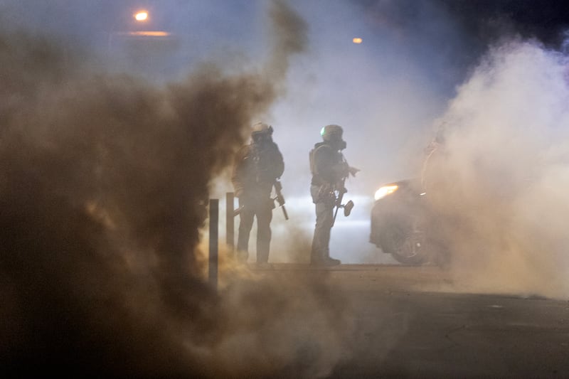 MINNEAPOLIS, MINNESOTA - JANUARY 14: Federal agents launch tear gas at residents protesting a shooting incident on January 14, 2026 in Minneapolis, Minnesota. According to reports, a federal agent shot a Venezuelan man who was resisting arrest. The Trump administration has sent a reported 2,000 federal plus federal agents into the area, with more on the way, as they make a push to arrest undocumented immigrants in the region. The Trump administration has sent a reported 2,000 federal plus federal agents into the area, with more on the way, as they make a push to arrest undocumented immigrants in the region. (Photo by Scott Olson/Getty Images)