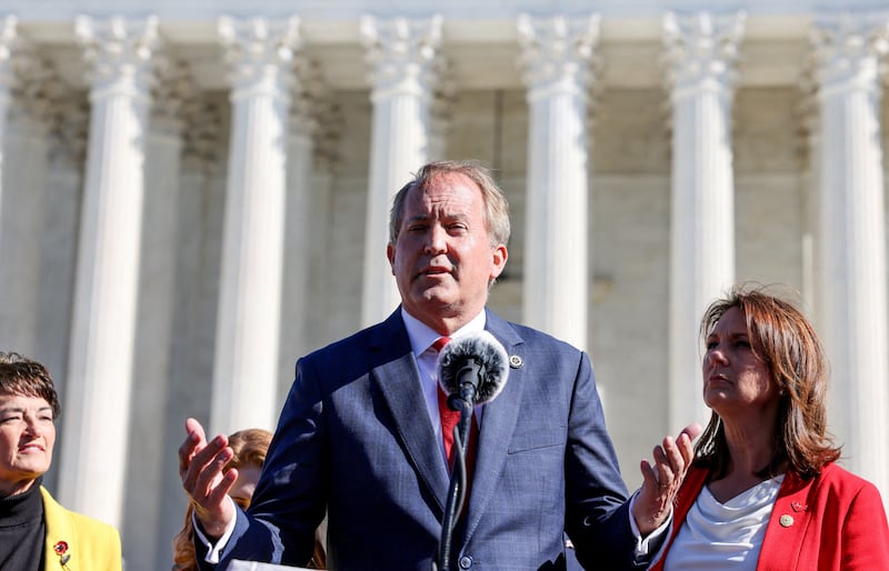 Texas Attorney General Ken Paxton speaks to anti-abortion supporters outside the U.S. Supreme Court following arguments over a challenge to a Texas law that bans abortion after six weeks in Washington, U.S., November 1, 2021. REUTERS/Evelyn Hockstein/File Photo