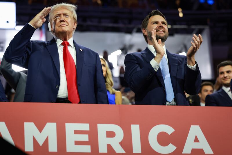 Donald Trump (L) and J.D. Vance appear on the first day of the Republican National Convention at the Fiserv Forum on July 15, 2024 in Milwaukee, Wisconsin.