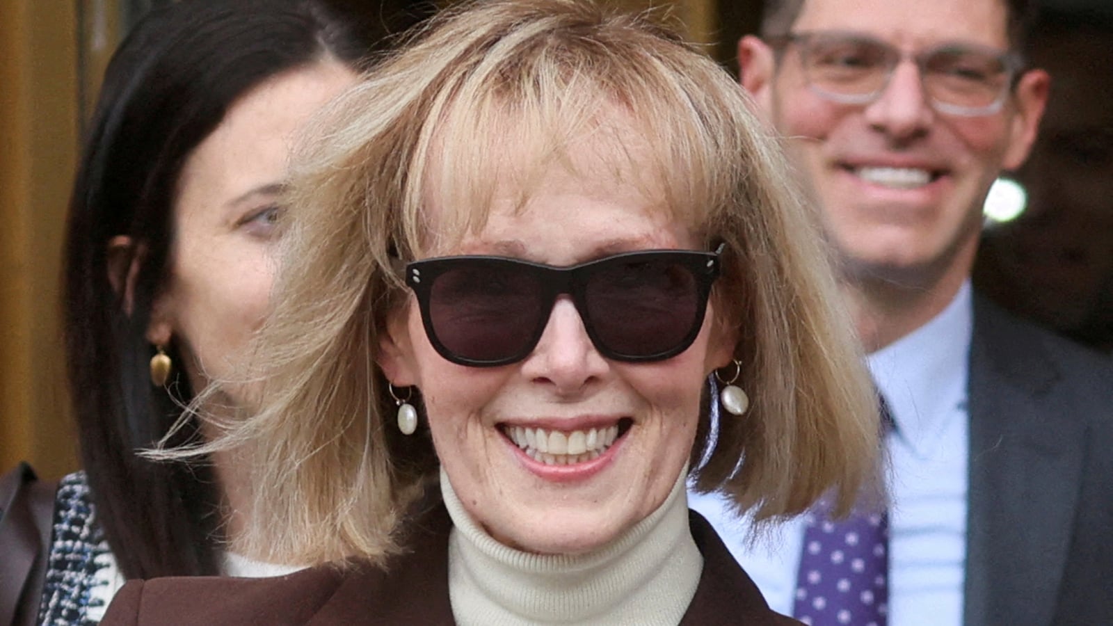 E. Jean Carroll reacts as she exits the Manhattan Federal Court following the verdict in the civil rape accusation case against former U.S. President Donald Trump, in New York City.
