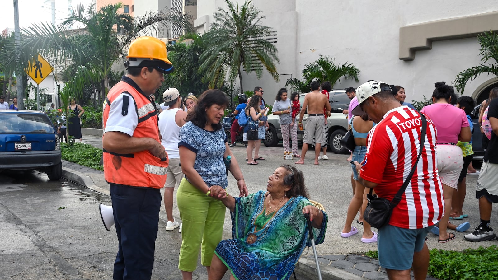 A tourist is assisted after being evacuated from a hotel during a 6.5 magnitude earthquake in Acapulco, Guerrero state, Mexico on January 2, 2026.