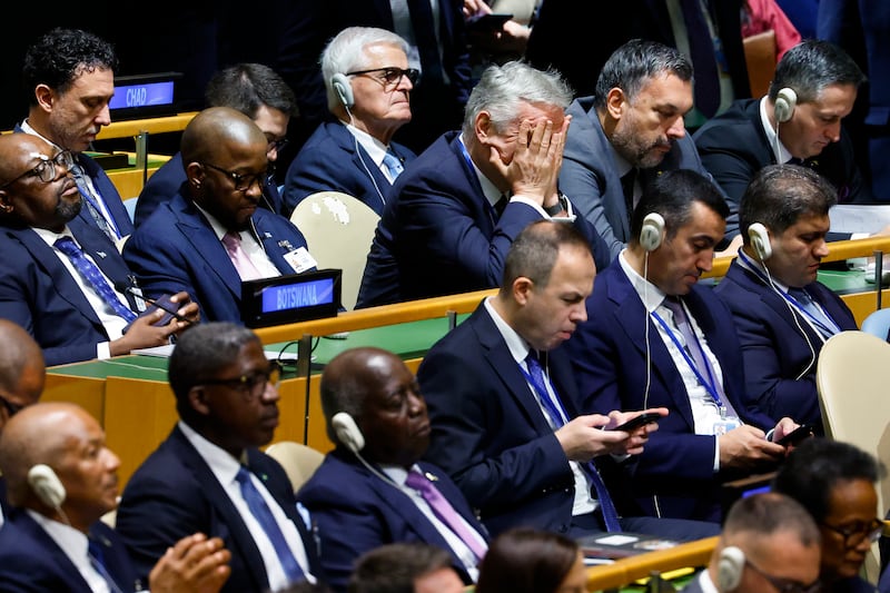 NEW YORK, NEW YORK - SEPTEMBER 22: A delegate from Bosnia and Herzegovina rubs his face as U.S. President Donald Trump speaks during the 81st session of the United Nations (U.N.) General Assembly at U.N. Headquarters on September 22, 2026 in New York City.