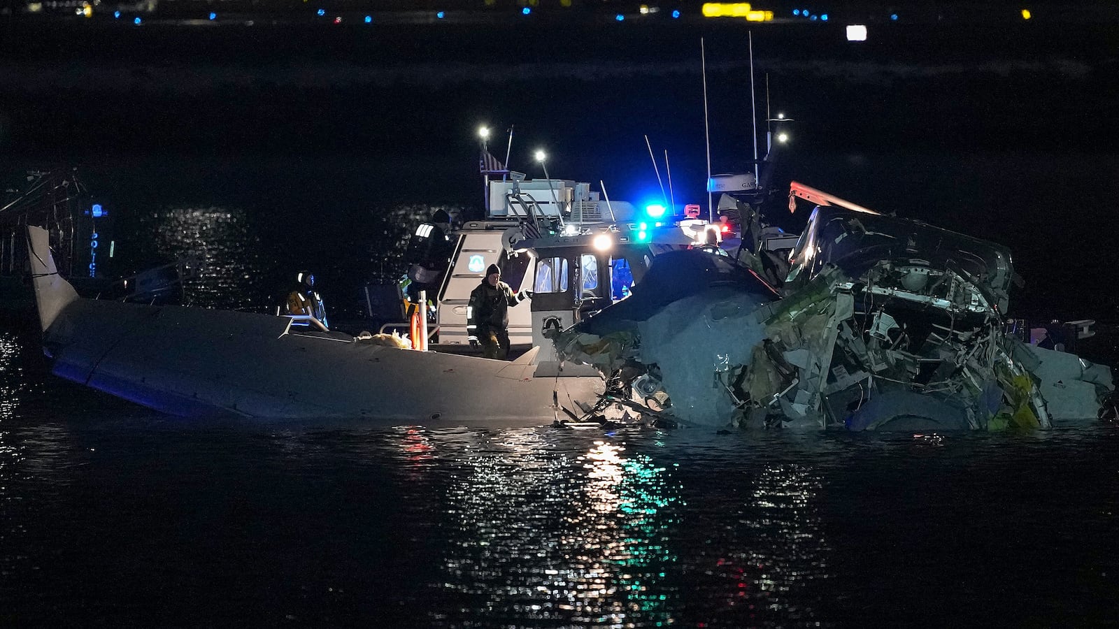 ARLINGTON, VIRGINIA - JANUARY 30: Emergency response units assess airplane wreckage in the Potomac River near Ronald Reagan Washington Airport on January 30, 2025 in Arlington, Virginia. An American Airlines flight from Wichita, Kansas collided with a helicopter while approaching Ronald Reagan National Airport. (Photo by Andrew Harnik/Getty Images)