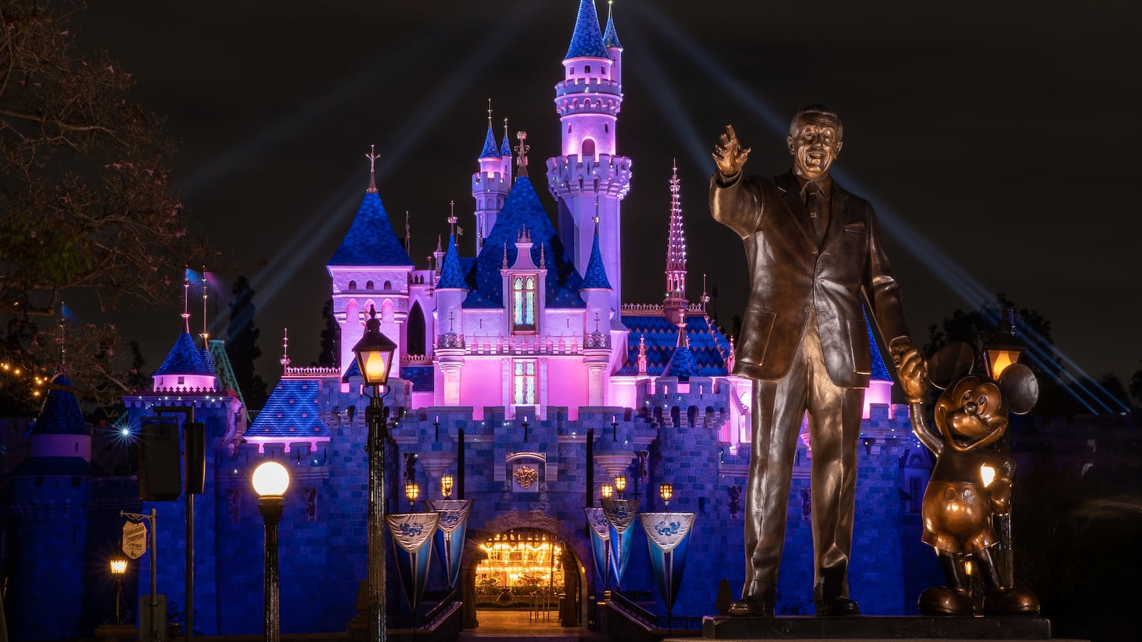 In this handout photo provided by Disneyland Resort, a view of Sleeping Beauty Castle in Disneyland Park illuminated during a special live streamed moment to welcome Cast Members back to the resort on April 26, 2021 at Disneyland Resort in Anaheim, California.