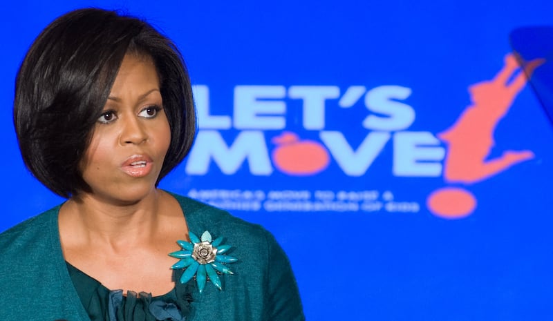 Michelle Obama speaks about her initiative, "Let's Move," a campaign to help combat childhood obesity, during an event in the State Dining Room of the White House in Washington, DC, February 9, 2010.