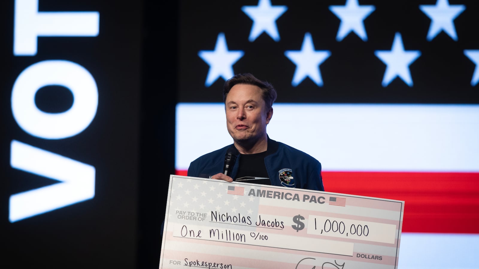 GREEN BAY, WISCONSIN - MARCH 30: Billionaire businessman Elon Musk prepares to give $1,000,000 to a Wisconsin voter during a town hall meeting he was hosting at the KI Convention Center on March 30, 2025 in Green Bay, Wisconsin. The town hall is being held in front of the state’s high-profile Supreme Court election between Circuit Court Judge Brad Schimel, who has been financially backed by Musk and endorsed by President Donald Trump, and Dane County Circuit Court Judge Susan Crawford. (Photo by Scott Olson/Getty Images)