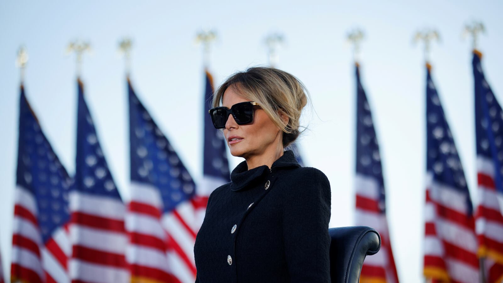 Melania Trump watches as then-President Donald Trump speaks at the Joint Base Andrews, Maryland, Jan. 20, 2021.