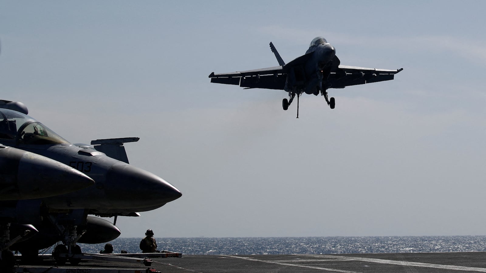 A U.S. navy F-18 Super Hornet lands on the flight deck on the USS Nimitz, off the coast of Busan, South Korea, March 27, 2023.