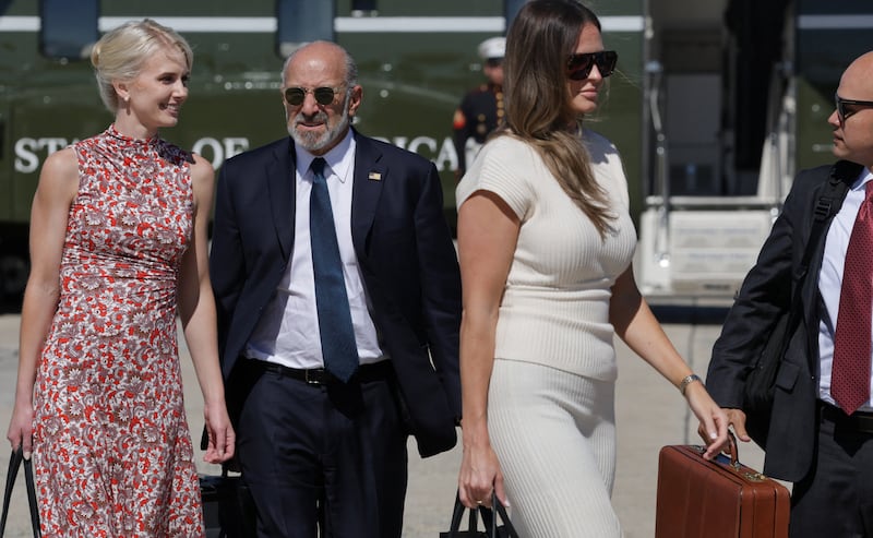 President Donald Trump's Executive Assistant Natalie Harp, Commerce Secretary Howard Lutnick, President Donald Trump's Special Assistant and Communications Advisor Margo Martin,  and White House Director of Oval Office Operations Walt Nauta walk to board Air Force One, as they join President Donald Trump (not pictured) as he travels to Texas and Oklahoma, at Joint Base Andrews, Maryland, October 1, 2026.