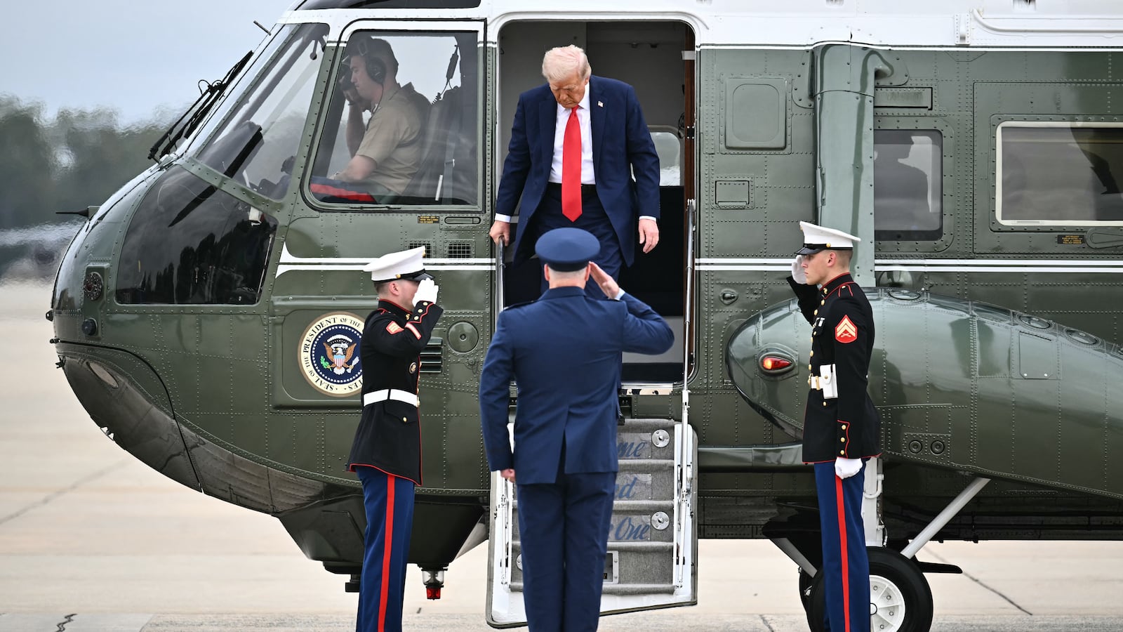 US President Donald Trump steps off Marine One before making his way to board Air Force One at Joint Base Andrews in Maryland on September 21, 2025. Trump is heading to Glendale, Arizona to attend the public memorial service for Charlie Kirk.