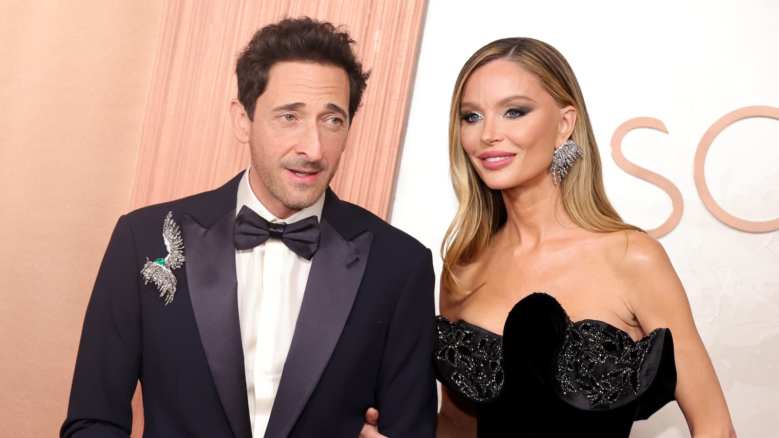 (L-R) Adrien Brody and Georgina Chapman attend the 97th Annual Oscars at Dolby Theatre on March 02, 2025 in Hollywood, California.