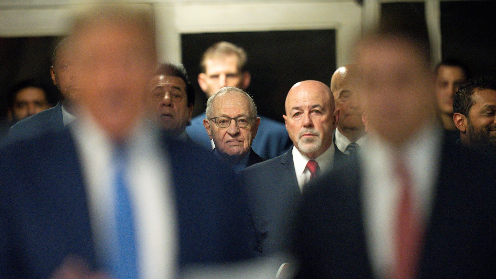 American lawyer Alan Dershowitz and Former New York City Police Commissioner Bernard Kerik look on, as Republican presidential candidate and former U.S. President Donald Trump appears at Manhattan Criminal Court, amid his trial on May 20, 2024.