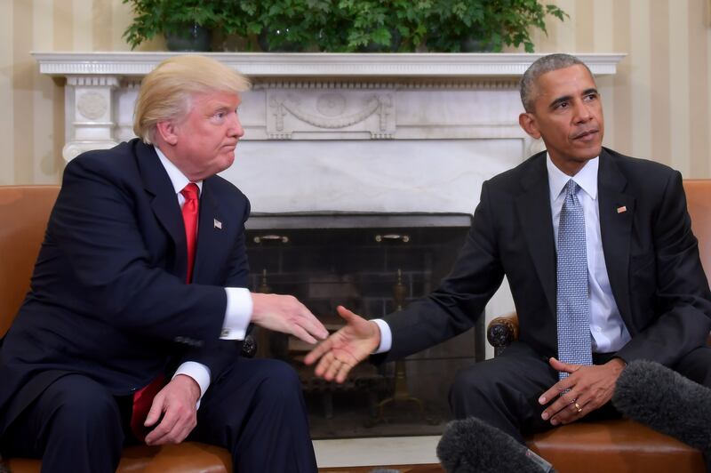 Obama and Trump shake hands