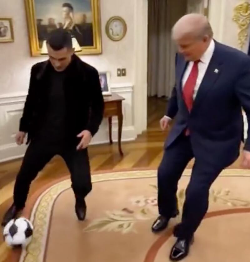 Trump shadows Ronaldo, as they pass the ball between each other in the Oval Office, in the AI-generated video.