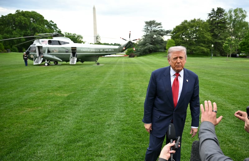 President Donald Trump speaks to journalists as he makes his way to board Marine One before departing from the South Lawn of the White House in Washington, DC on May 8, 2026.