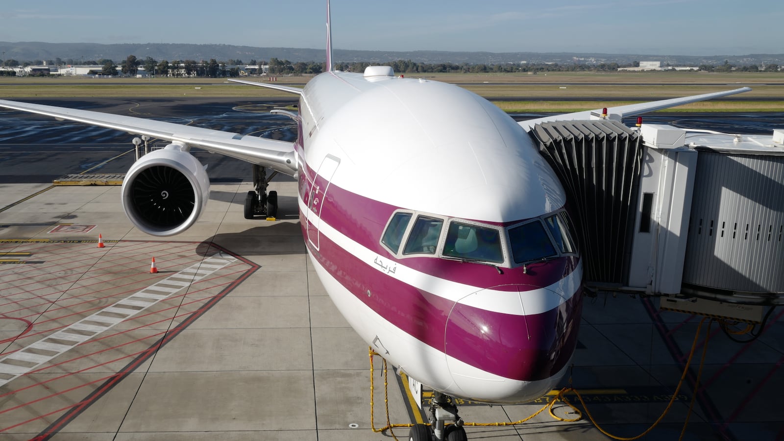 A Qatar airlines aircraft parked.
