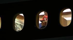 President Donald Trump is seen aboard Air Force One checking a Kennedy Center large printout after landing at Joint Base Andrews, Maryland on September 16, 2026.