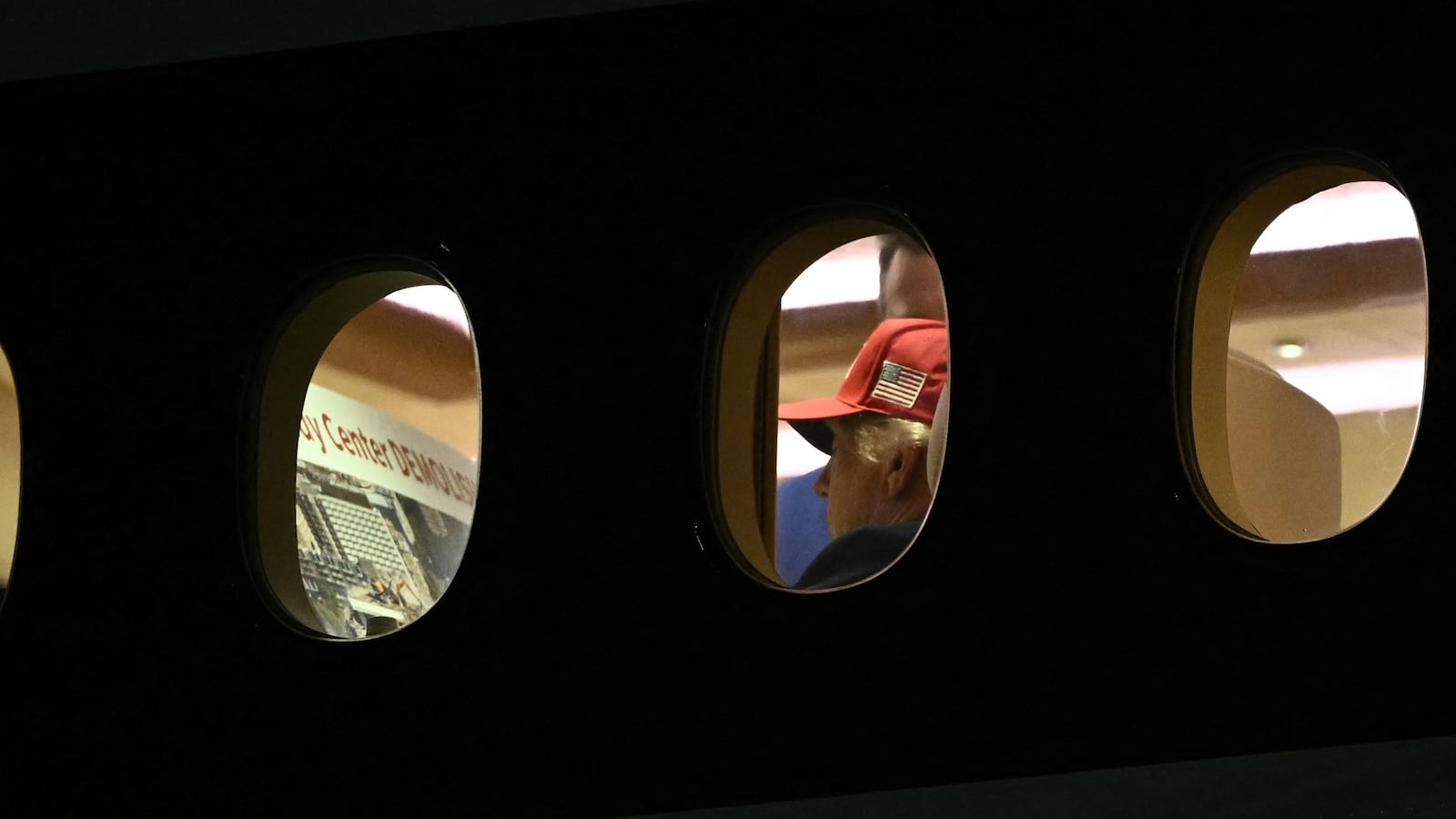President Donald Trump is seen aboard Air Force One checking a Kennedy Center large printout after landing at Joint Base Andrews, Maryland on September 16, 2026.