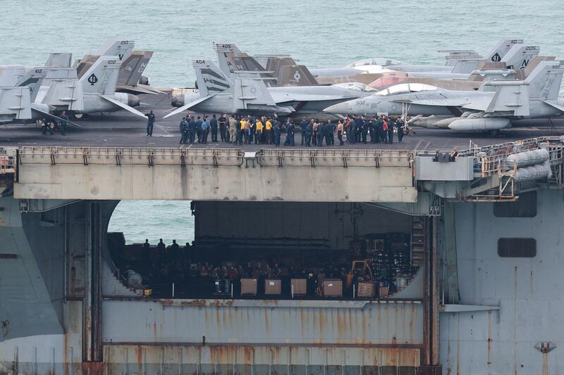 Personnel and aircraft on the deck of the U.S. Navy Nimitz-class aircraft carrier USS Abraham Lincoln as it sails toward Laem Chabang Port before docking for a rest stop following a long deployment in the Middle East, in Chonburi province, Thailand, September 2, 2026.