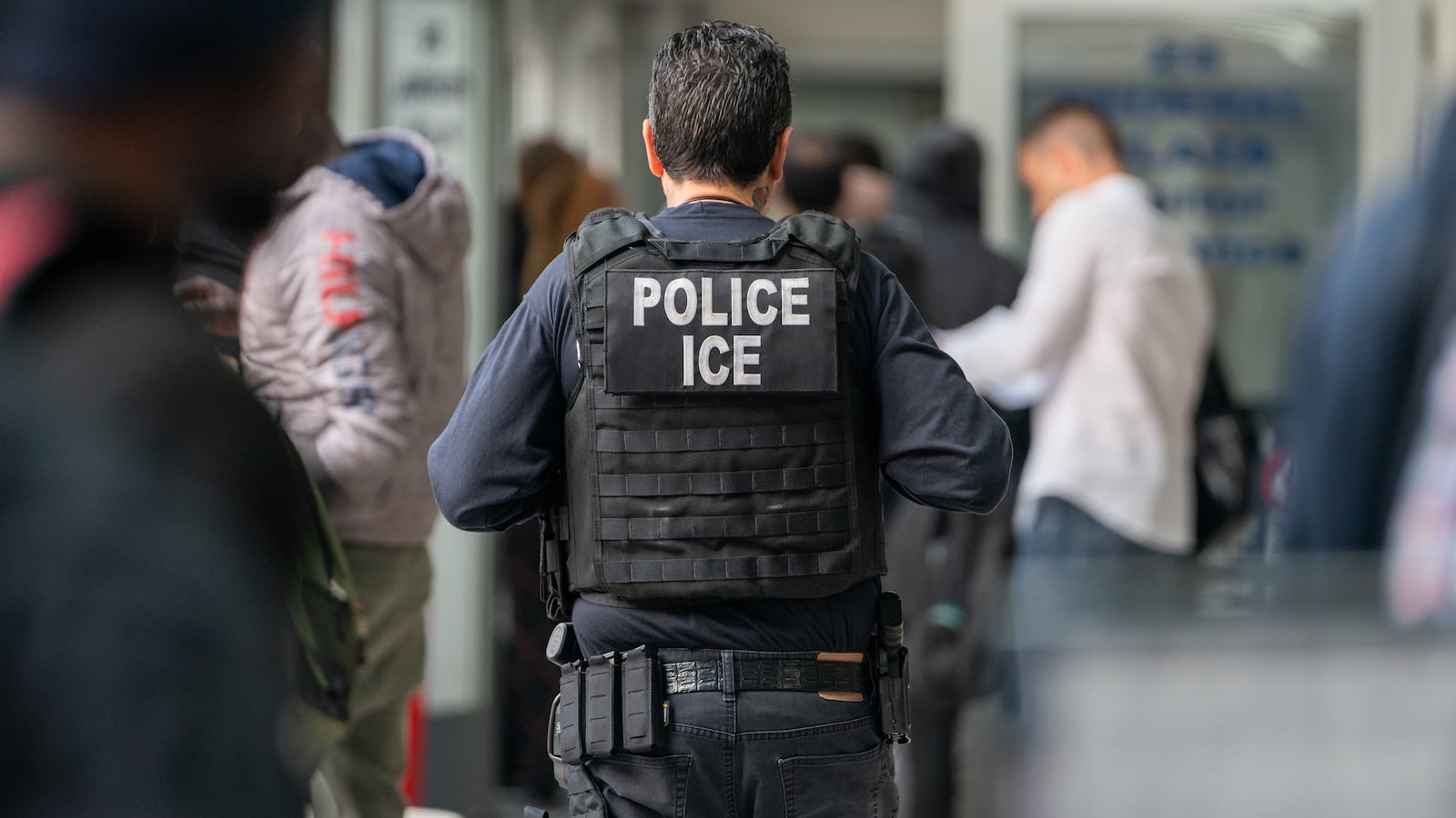 An ICE agent monitors hundreds of asylum seekers.