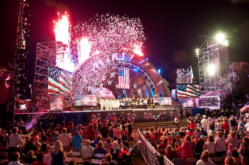 The Boston Pops orchestra performing with the US Navy Sea Chanters at the Hatch Shell on the Charles River Esplanade during the dress rehearsal for the July 4th concert in Boston, MA on July 3, 2012.
