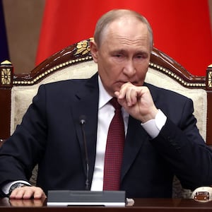 BISHKEK, KYRGYZSTAN - NOVEMBER 26: Russian President Vladimir Putin grimaces during a signing ceremony at the Yntymak Ordo Presidential Palace, on November 26, 2025 in Bishkek, Kyrgyzstan. Vladimir Putin makes a three-day state visit to the Kyrgyz Republic. During his stay he takes part in a regular session of the Collective Security Council of the Collective Security Treaty Organisation (CSTO). Putin will also hold talks with President of Kyrgyzstan Sadyr Japarov to discuss development of the strategic partnership and allied relationship between Russia and Kyrgyzstan. (Photo by Contributor/Getty Images)