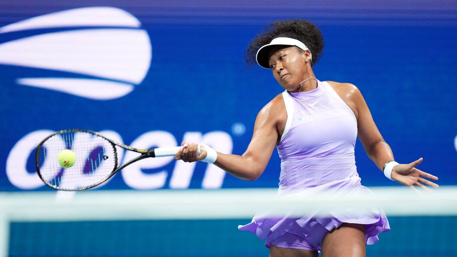Naomi Osaka of Japan hits to Danielle Collins of the United States on day two of the 2022 U.S. Open tennis tournament at USTA Billie Jean King National Tennis Center.