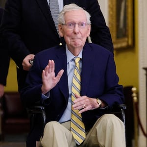 Senator Mitch McConnell waves at reporters outside the Senate Chamber after he returned to Capitol Hill  on September 14, 2026 for the first time in more than three months.
