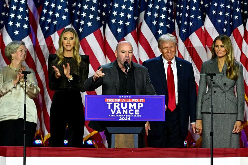 CEO of Ultimate Fighting Championship Dana White (C) speaks alongside former US President and Republican presidential candidate Donald Trump during an election night event at the West Palm Beach Convention Center in West Palm Beach, Florida, on November 6, 2024. Republican former president Donald Trump closed in on a new term in the White House early November 6, 2024, just needing a handful of electoral votes to defeat Democratic Vice President Kamala Harris. (Photo by Jim WATSON / AFP) (Photo by JIM WATSON/AFP via Getty Images)