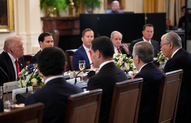Trump listens as Tokayev (far right) delivers flattering prepared remarks at the White House dinner.