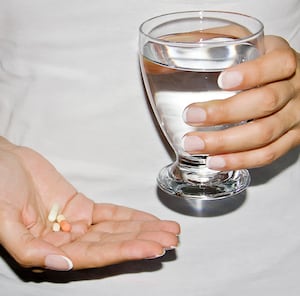 Supplements in a hand