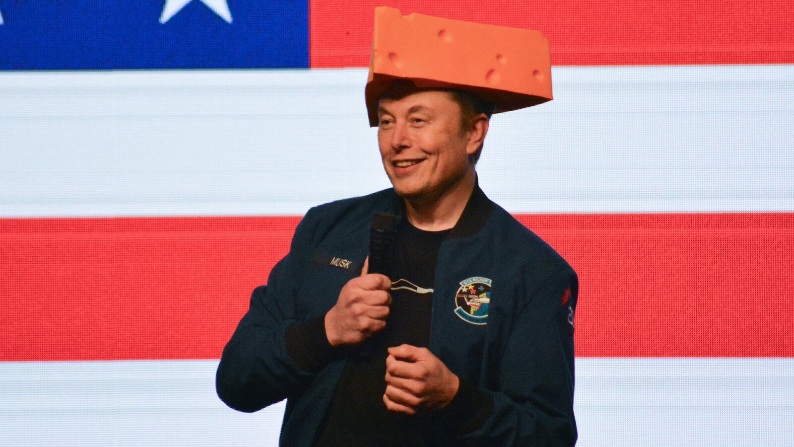 Elon Musk wears a cheesehead hat as he speaks during a town hall in Green Bay, Wisconsin on March 30, 2025. An election to choose a new supreme court judge in the northern US state of Wisconsin wouldn't usually make much noise.
But when the world's richest man took an interest in the race, people began to notice, and protests on March 30 drew crowds.
Tech baron and political provocateur Elon Musk, a close ally of President Donald Trump, has poured money into the Tuesday election, hoping to secure a conservative win. (Photo by Robin LEGRAND / AFP) (Photo by ROBIN LEGRAND/AFP via Getty Images)