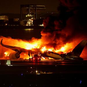 Firefighters work at Haneda International Airport after Japan Airlines’ A350 airplane caught on fire in Tokyo, Japan, Jan. 2, 2024.