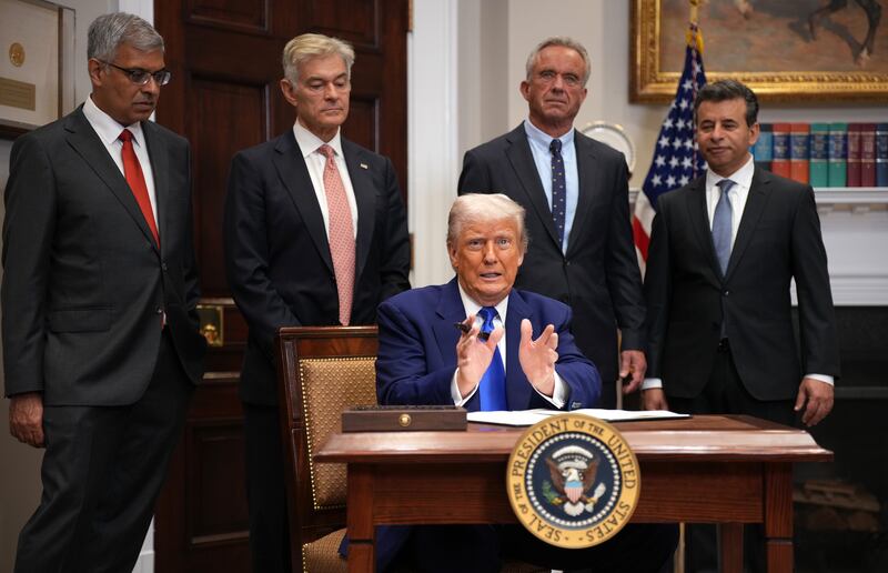 President Donald Trump speaks during an event in the Roosevelt Room of the White House on May 12, 2025, in Washington, DC, alongside National Institutes of Health (NIH) Director Jay Bhattacharya, Administrator for the Centers for Medicare & Medicaid Services (CMS) Mehmet Oz, Human Services Secretary Robert F. Kennedy Jr. (C) and Food and Drug Administration (FDA) Commissioner Martin Makary.