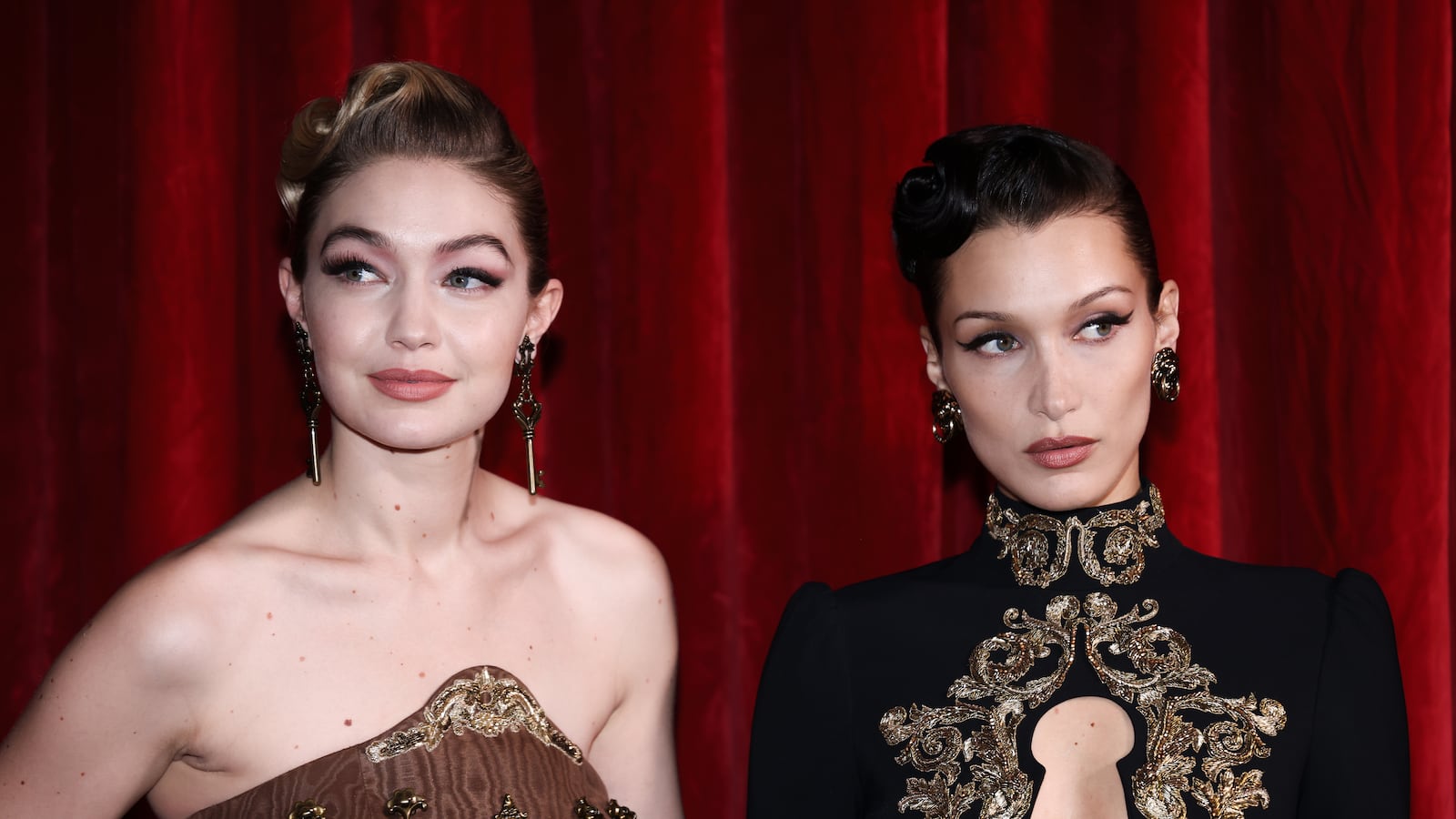 Gigi Hadid and Bella Hadid pose backstage of the Moschino fashion show during the Milan Fashion Week Fall/Winter 2022/2023 on February 24, 2022 in Milan, Italy.