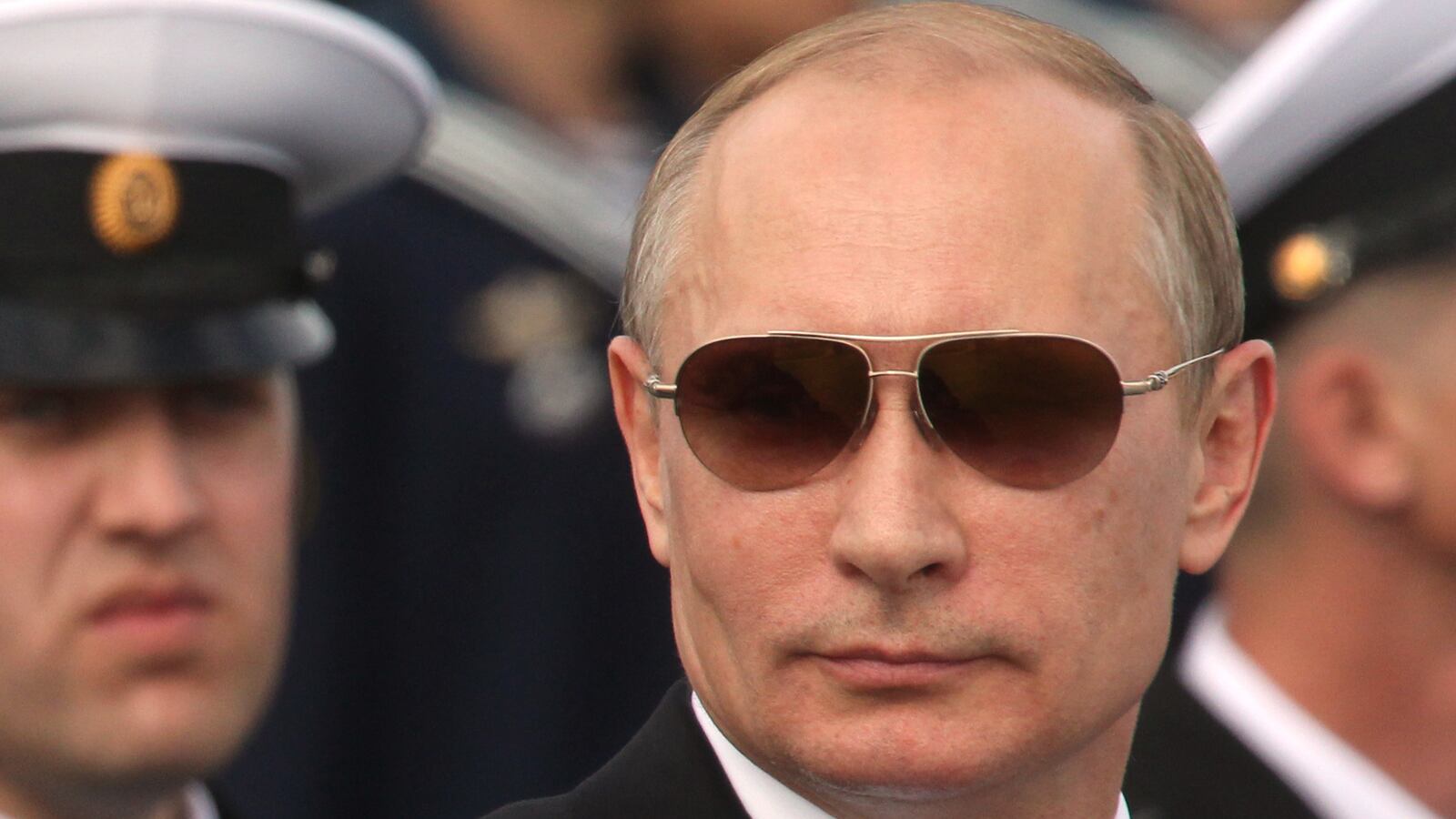 articles/2014/07/30/moscow-remains-defiant-but-feels-the-heat-as-new-sanctions-loom/140729-nemtsova-putin-tease_k43o6p