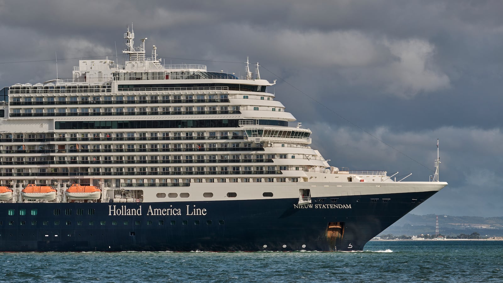 MS Nieuw Statendam, a 99,902 GT Pinnacle-class cruise ship operated by Holland America Line (HAL), a division of Carnival Corporation & plc., sails the Tagus River after leaving the Cruise Terminal on June 03, 2022 in Lisbon, Portugal.