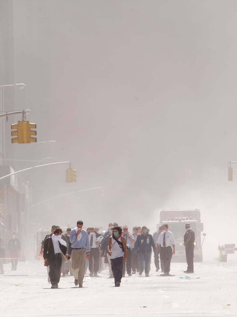 Dust swirls around south Manhattan moments after a tower of the World Trade Center collapsed September 11, 2001 in New York City.