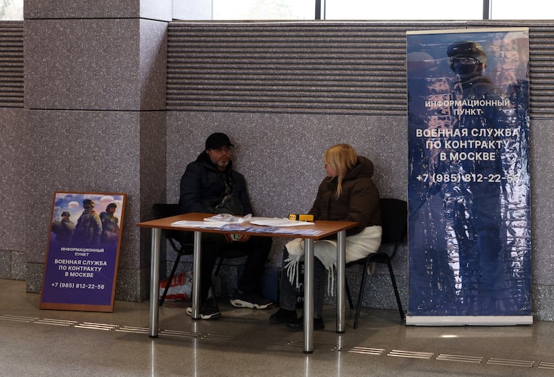 MOSCOW, RUSSIA - APRIL 16: Volunteers chat at an information stand at a metro station to recruit contract soldiers for service in the Russian army fighting in Ukraine, on April 16, 2026, in Moscow, Russia. (Photo by Contributor/Getty Images)
