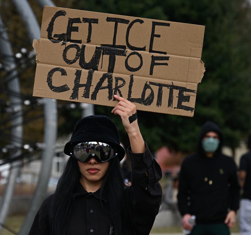 Protesters gather at First Ward Park for the 'No Border Patrol In Charlotte' rally to raise their voices for the immigrant community and against ICE raids and Border Patrol activity in Charlotte, North Carolina, US on November 15, 2025.