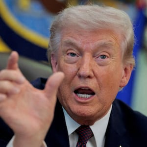 FILE PHOTO: U.S. President Donald Trump speaks during the signing ceremony for an executive order on mail ballots, in the Oval Office of the White House in Washington, D.C., March 31, 2026.
