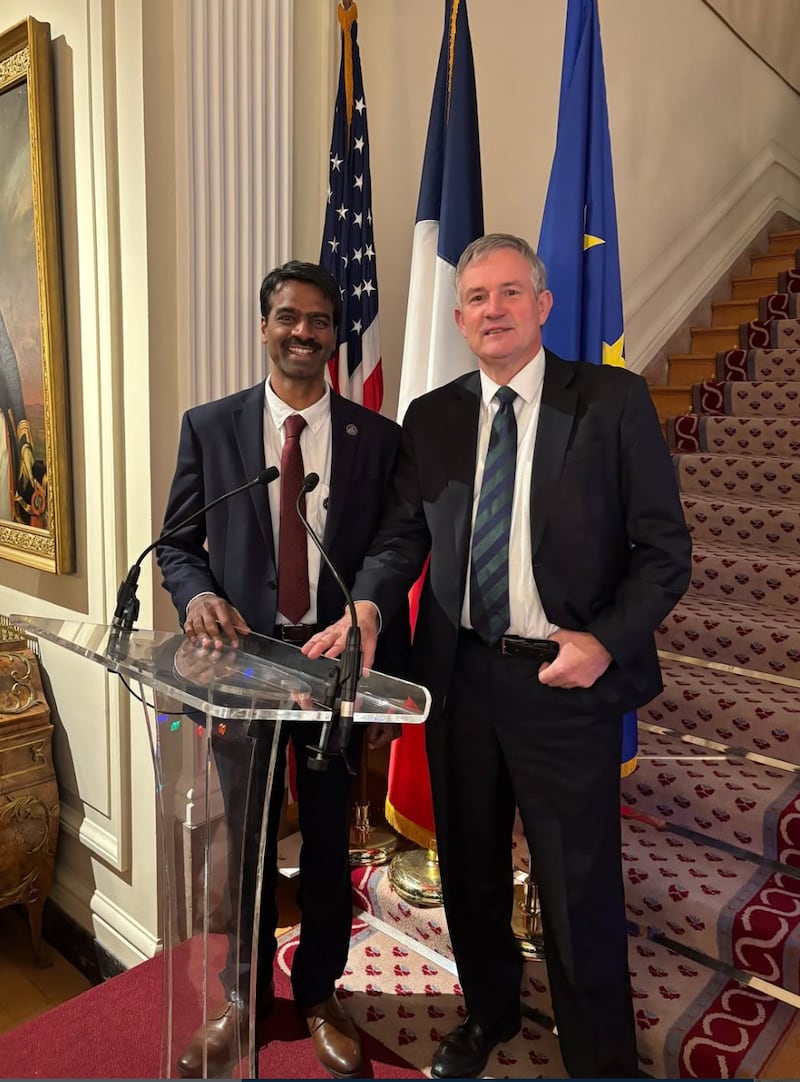 The acting director was socializing at a holiday reception on Saturday with the French ambassador, Laurent Bili.